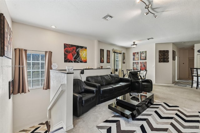 13114 SW 44th St Unit 2204, Miramar, FL 33027 - carpeted living area featuring a textured ceiling, track lighting, and recessed lighting