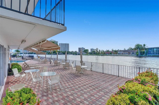 view of patio featuring a water view