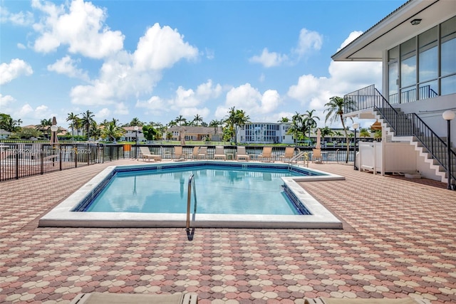 view of swimming pool with a patio area