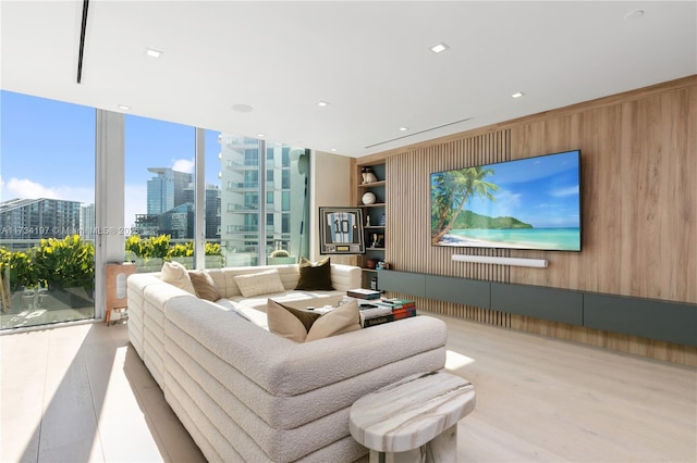 living room featuring wood walls and built in shelves