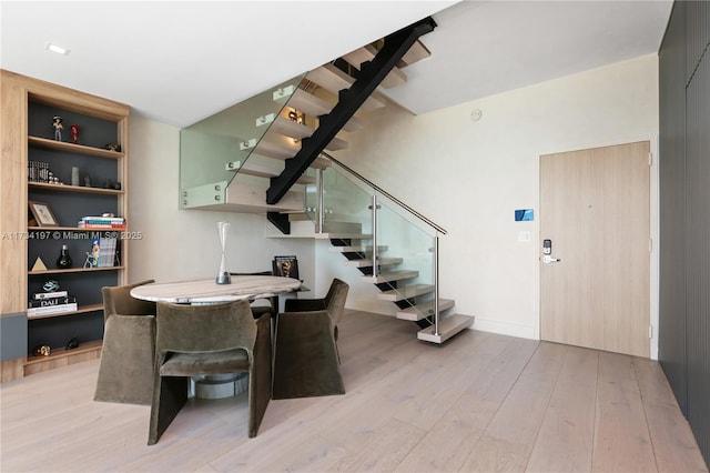 dining space featuring light wood-type flooring