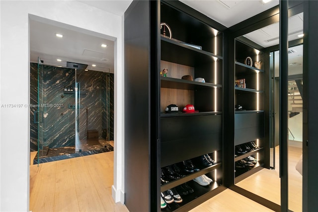 wine cellar with hardwood / wood-style floors and built in features