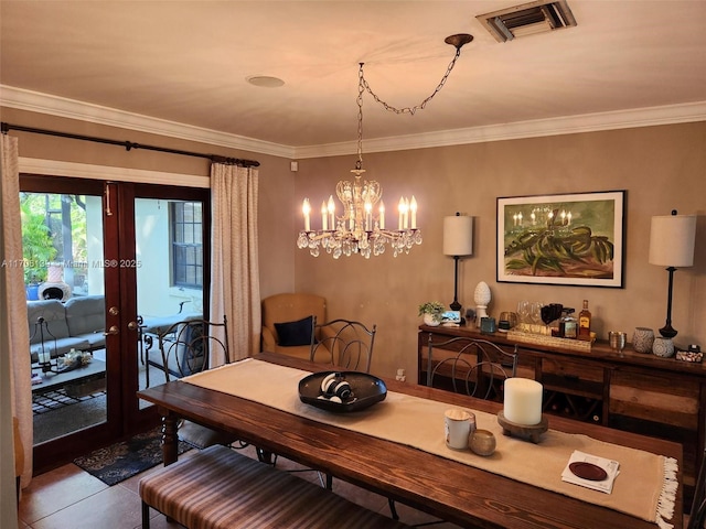 tiled dining area with an inviting chandelier, crown molding, and french doors