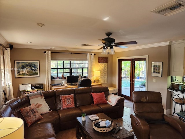 tiled living room featuring crown molding, ceiling fan, a healthy amount of sunlight, and french doors