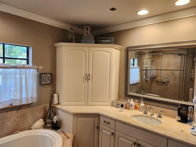 bathroom with independent shower and bath, vanity, and crown molding