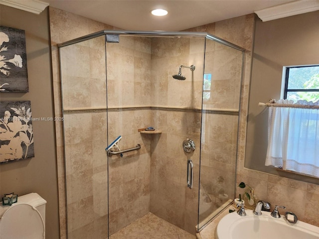 bathroom featuring independent shower and bath and toilet