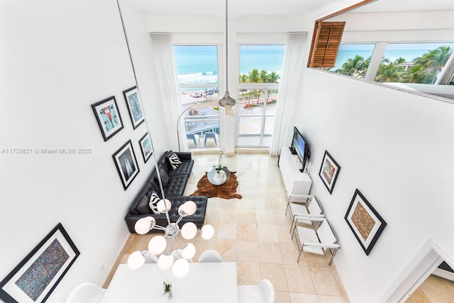 5445 Collins Ave Unit M15, Miami Beach, FL 33140 - living area featuring light tile patterned floors and baseboards