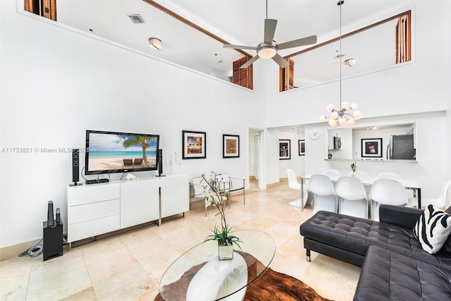 5445 Collins Ave Unit M15, Miami Beach, FL 33140 - living room featuring a high ceiling, light tile patterned floors, ceiling fan with notable chandelier, and visible vents