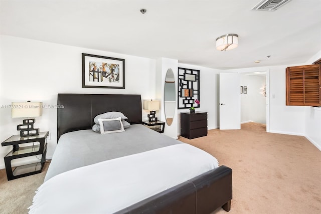 bedroom featuring light carpet