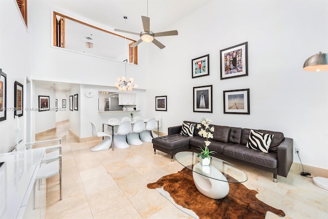 5445 Collins Ave Unit M15, Miami Beach, FL 33140 - living area with a towering ceiling and a ceiling fan