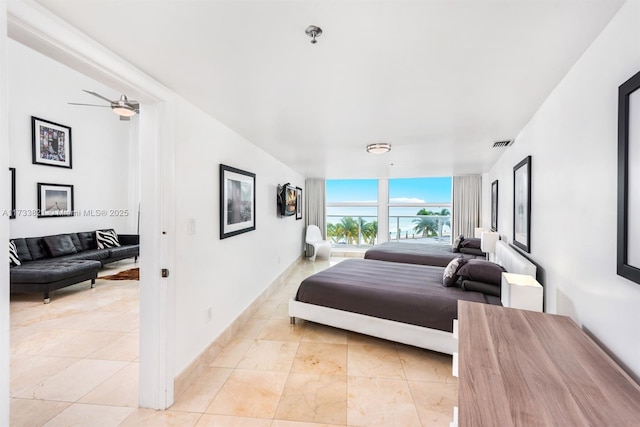 5445 Collins Ave Unit M15, Miami Beach, FL 33140 - bedroom with light tile patterned flooring, visible vents, and baseboards