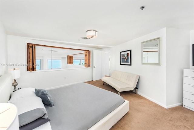 5445 Collins Ave Unit M15, Miami Beach, FL 33140 - bedroom with baseboards and light carpet