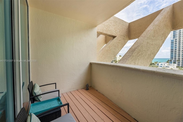 balcony featuring a water view