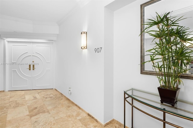 entrance foyer featuring crown molding