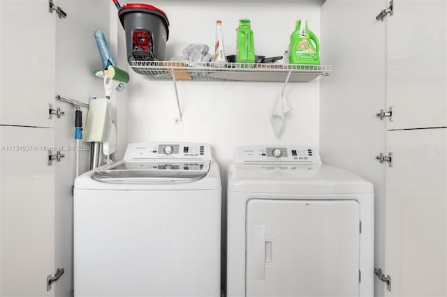 laundry room with separate washer and dryer