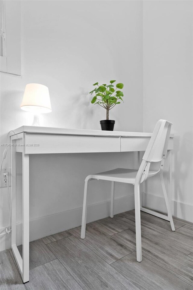 home office with light wood-type flooring