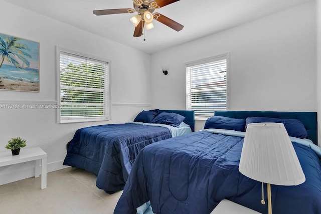 tiled bedroom with ceiling fan