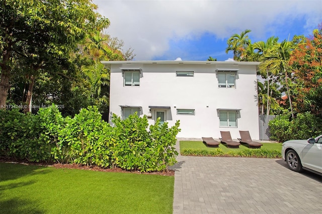 view of side of property featuring a yard