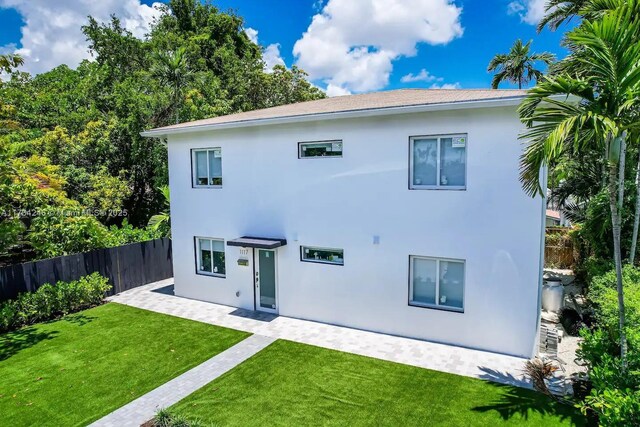 view of side of home featuring a yard