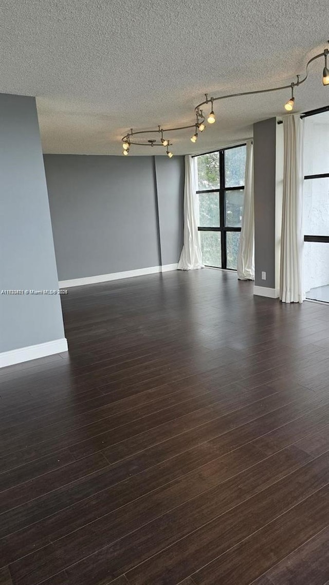 empty room with dark wood-type flooring