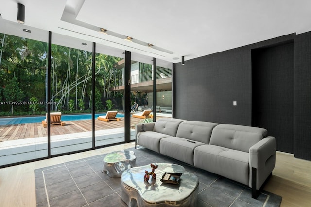 4040 Kiaora St, Miami, FL 33133 - living room with a wall of windows and wood finished floors