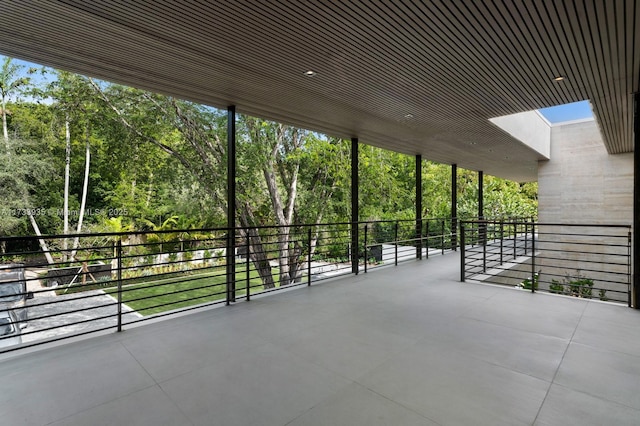 view of patio featuring a balcony