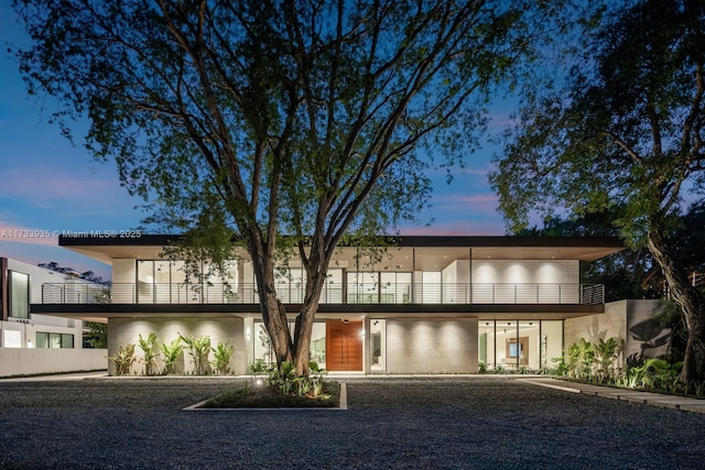 view of front of house featuring a balcony