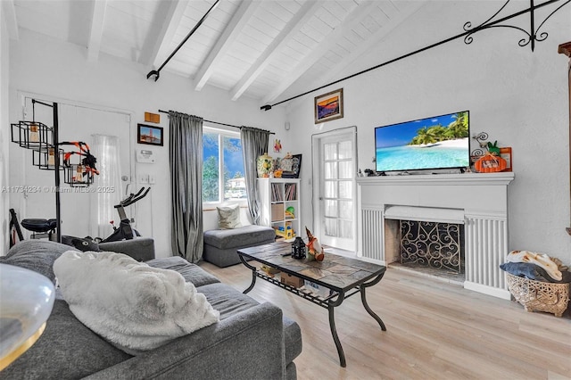 living room with beamed ceiling, high vaulted ceiling, light hardwood / wood-style floors, and wooden ceiling