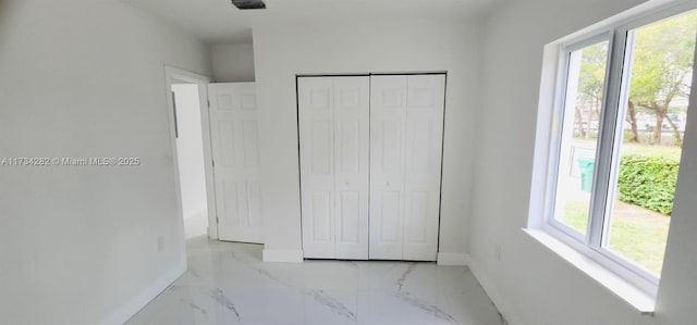 unfurnished bedroom featuring a closet