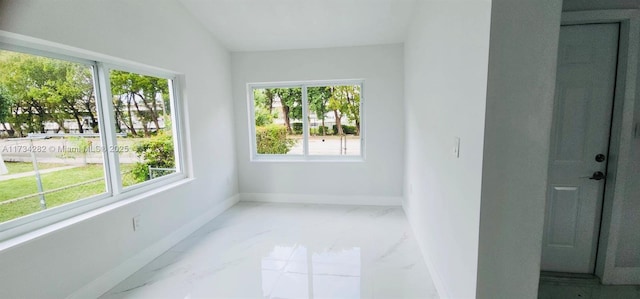 unfurnished sunroom featuring lofted ceiling