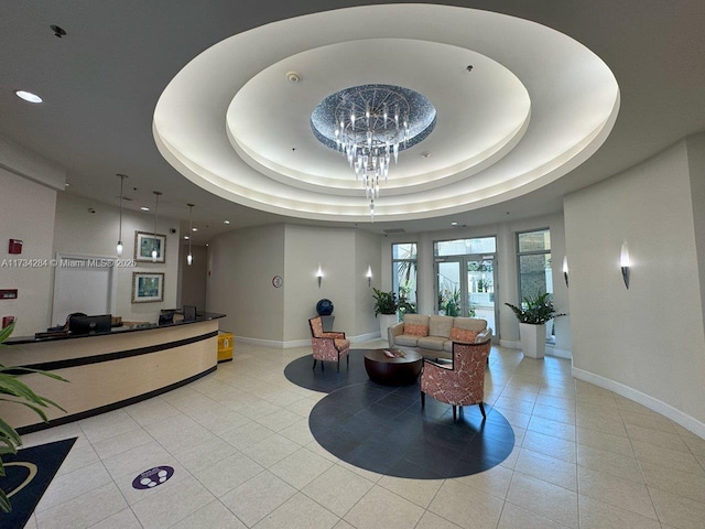 reception area featuring an inviting chandelier