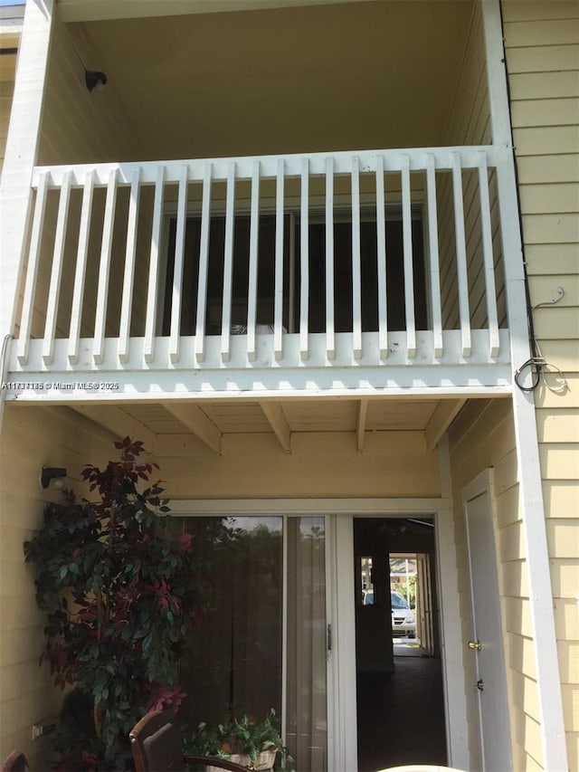 entrance to property with a balcony