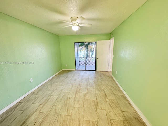 spare room featuring ceiling fan, a textured ceiling, and light wood-type flooring