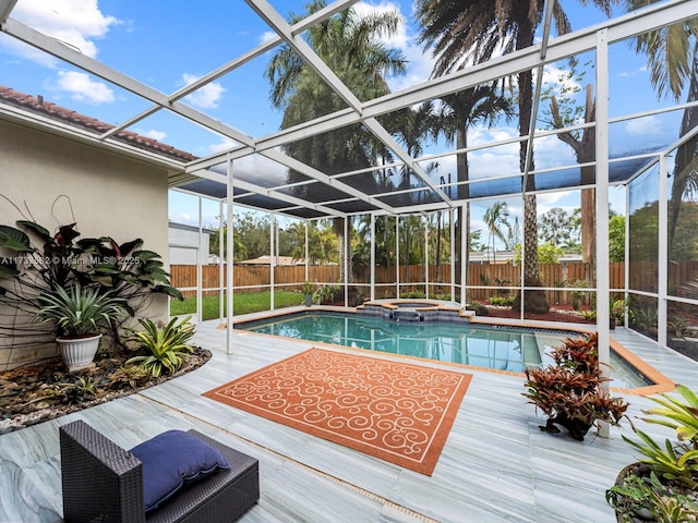 view of pool featuring an in ground hot tub and a lanai