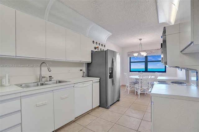 kitchen with sink, decorative light fixtures, stainless steel fridge with ice dispenser, dishwasher, and white cabinets