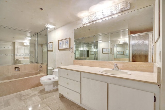 full bathroom featuring vanity, toilet, and separate shower and tub