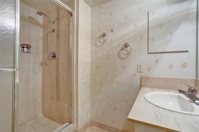 bathroom featuring vanity and an enclosed shower