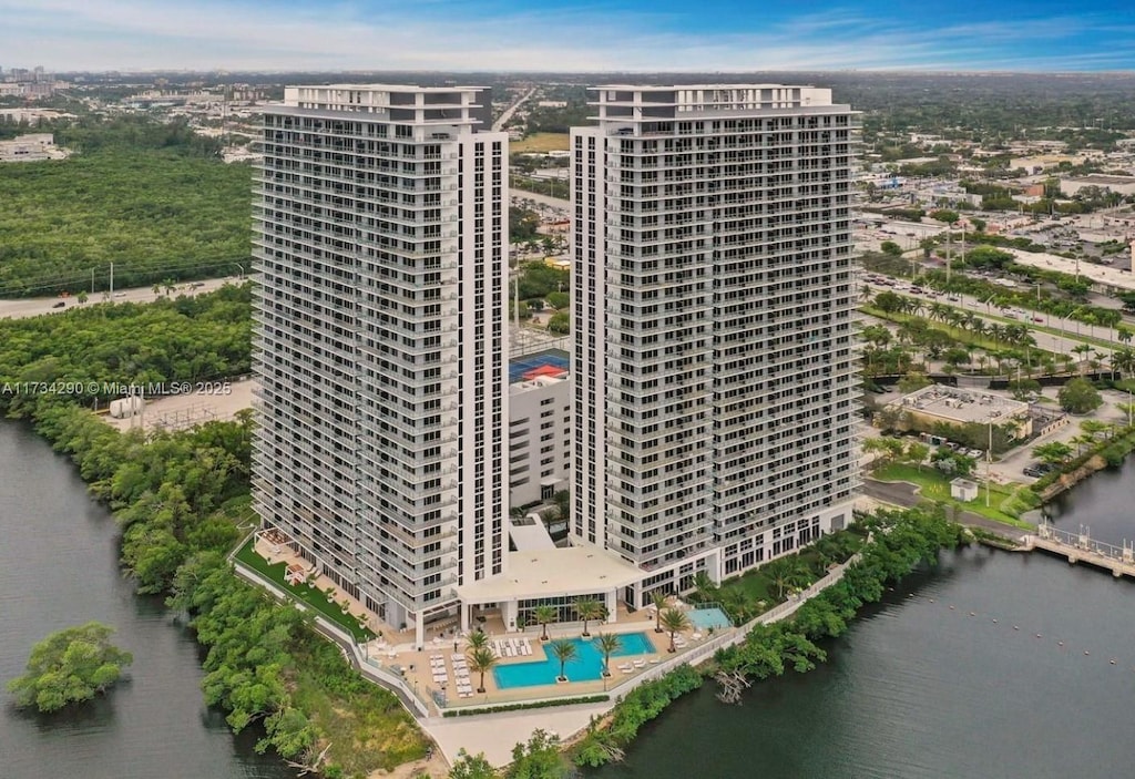 birds eye view of property with a water view