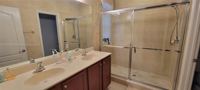 bathroom featuring walk in shower, vanity, and tile patterned flooring