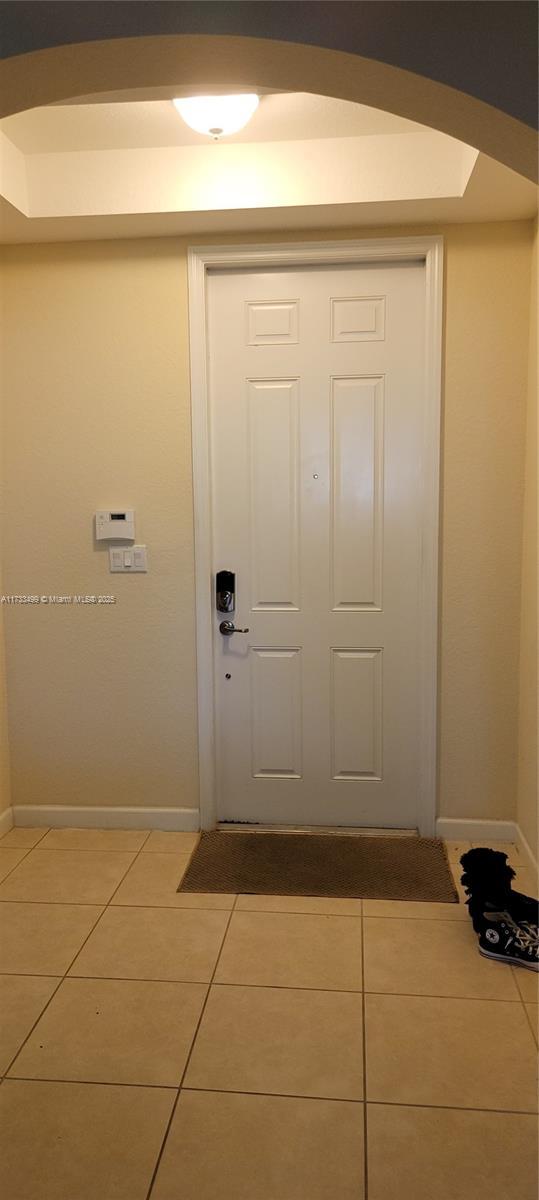 entryway with tile patterned floors