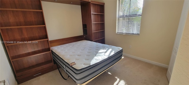 bedroom featuring light carpet