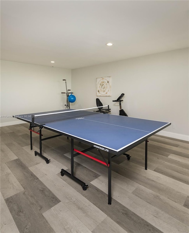 game room with light hardwood / wood-style floors