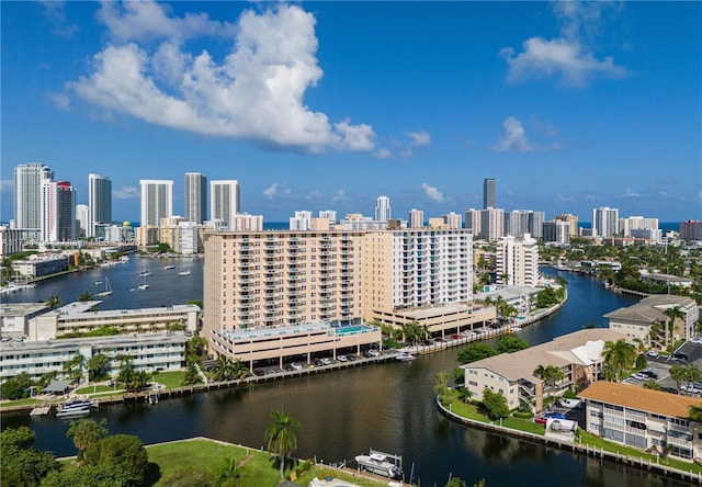 birds eye view of property with a city view and a water view