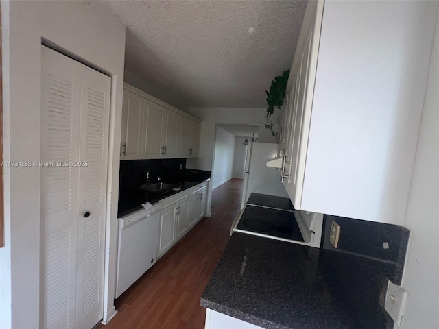 kitchen with dark wood-type flooring, white cabinetry, tasteful backsplash, a textured ceiling, and dishwasher