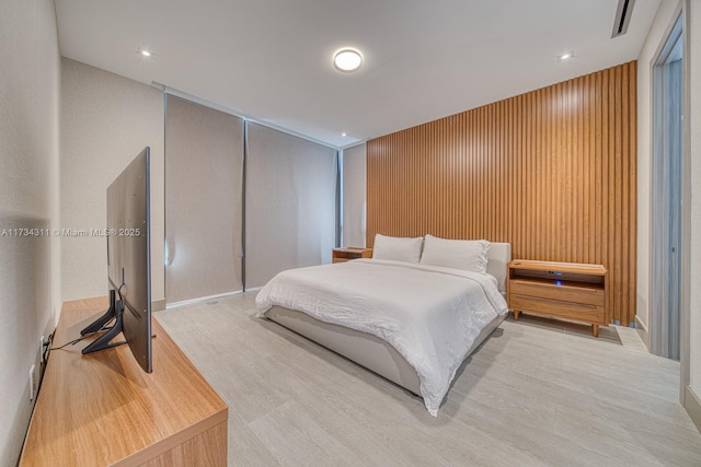 bedroom with light hardwood / wood-style flooring