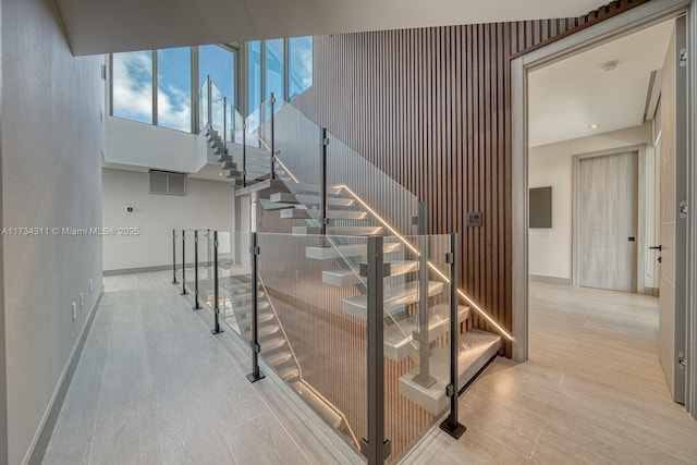 staircase featuring hardwood / wood-style floors