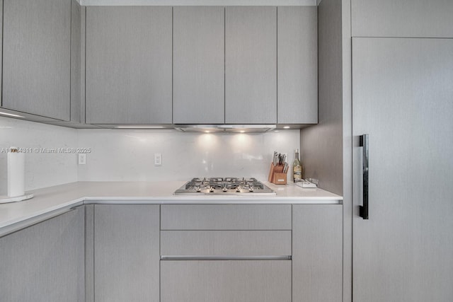 kitchen featuring gray cabinets and stainless steel gas cooktop