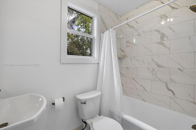 full bathroom featuring shower / bathtub combination with curtain, sink, and toilet