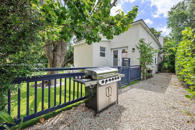 exterior space with a yard and french doors