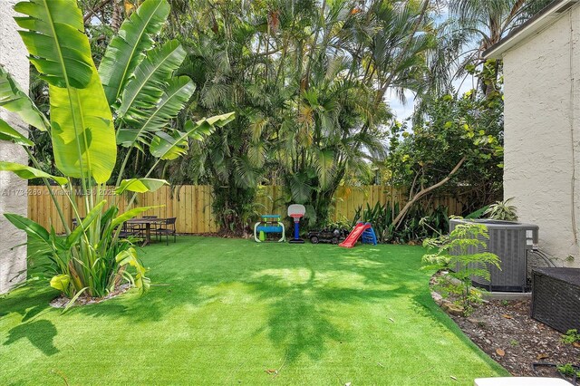 view of yard with central AC